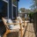 Two Wicker Chairs on Apartment Balcony